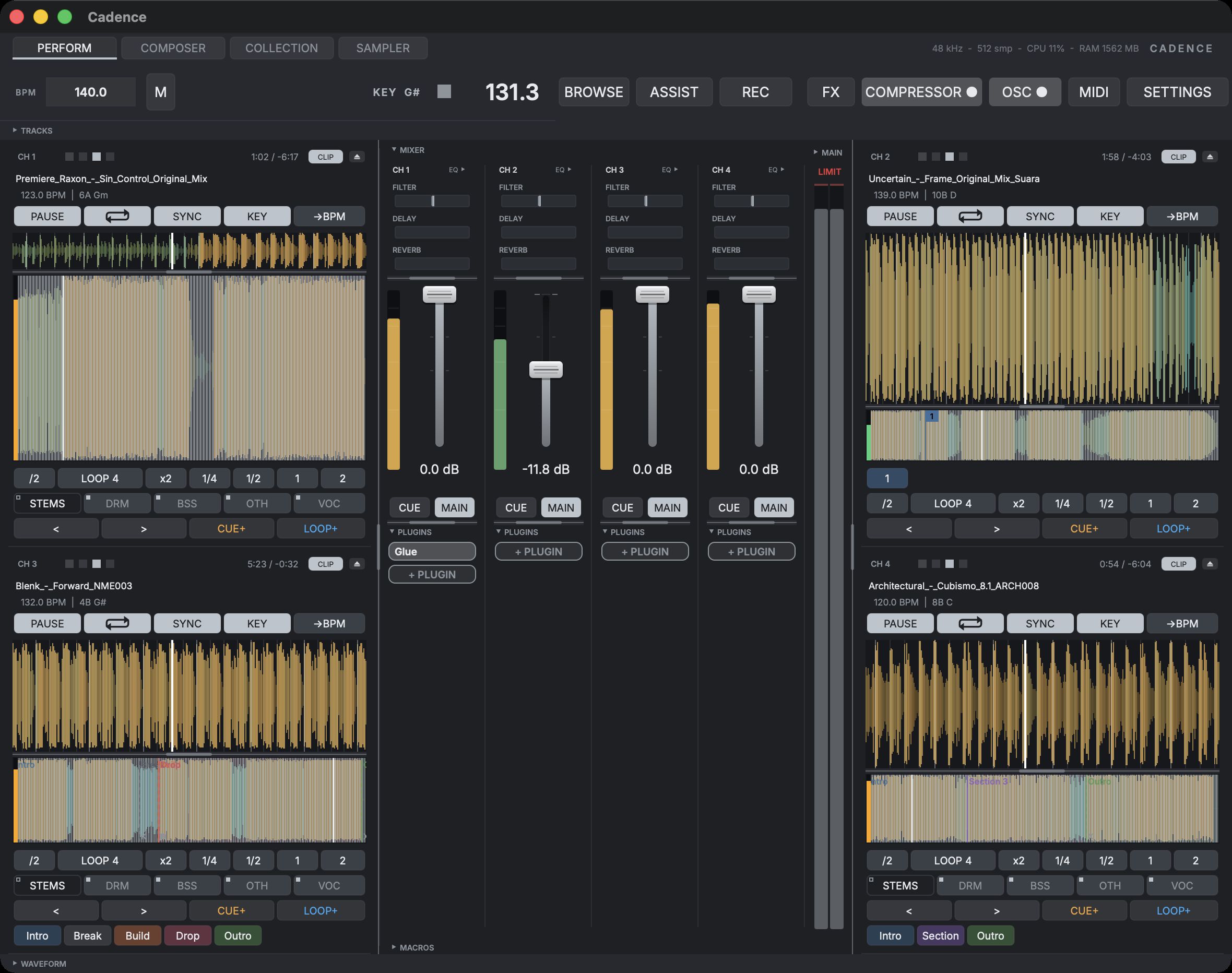 The Perform view: four mixer strips with faders and meters at the centre, a deck waveform either side of them, and the collection docked below